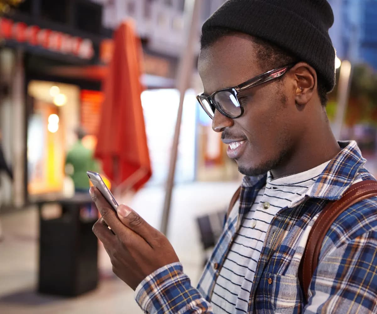 Traveller checking a bus booking on a phone